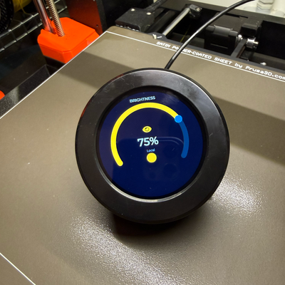 CrowPanel rotary display showing brightness controller UI with amber arc